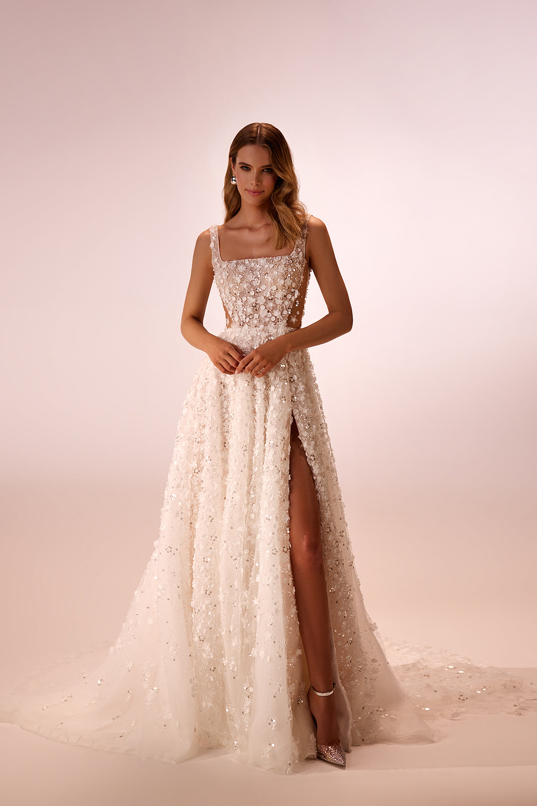 In the studio, Cathelyn wedding dress with an A-line floral lace skirt and square neckline