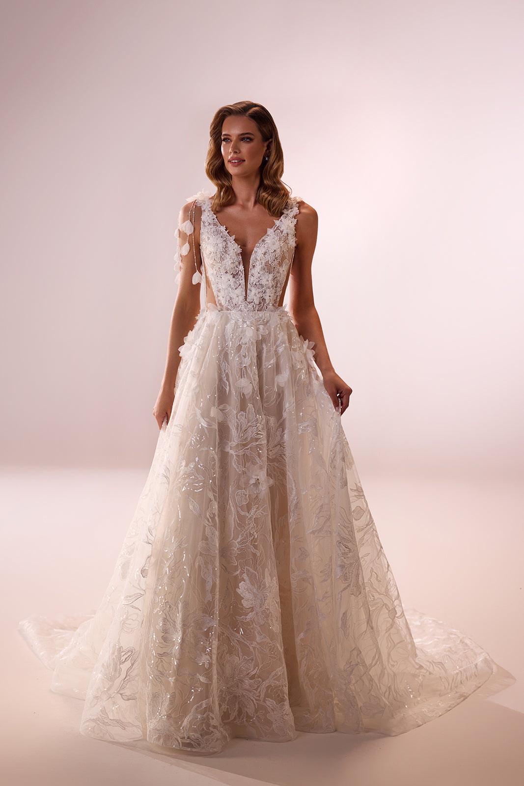 Celia A-line wedding dress from the front, with a deep V neckline and sparkling floral embroidery