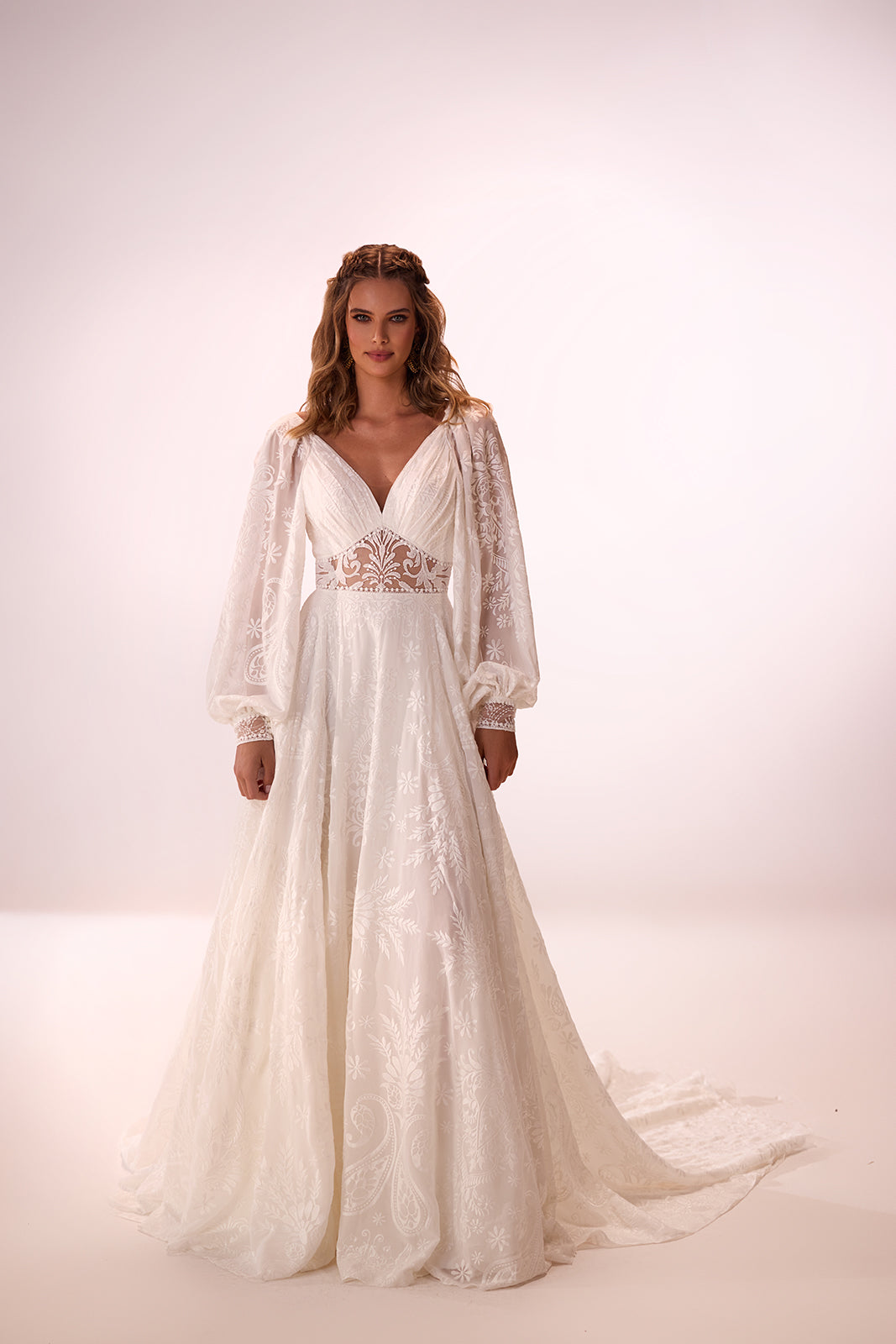 Ellianna wedding dress from the front in the studio, with a V neckline and wide cuffed lace sleeves