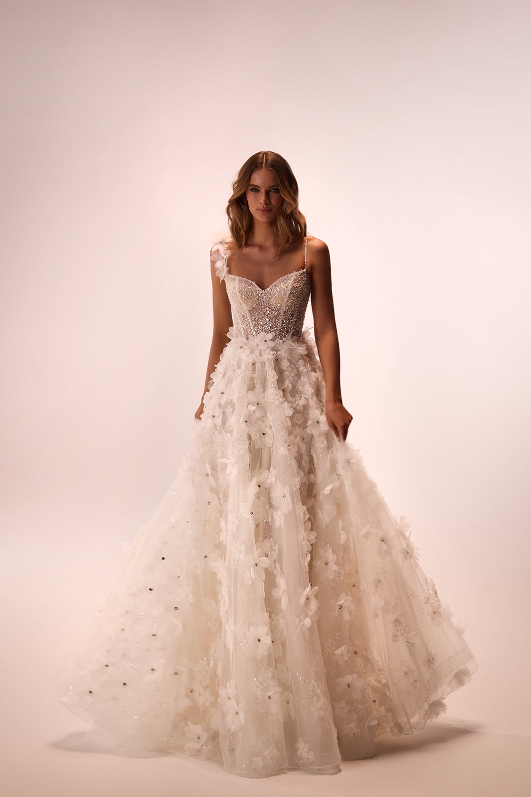 Elodie A-line wedding dress in a full-length front view, with 3D flowers over tulle
