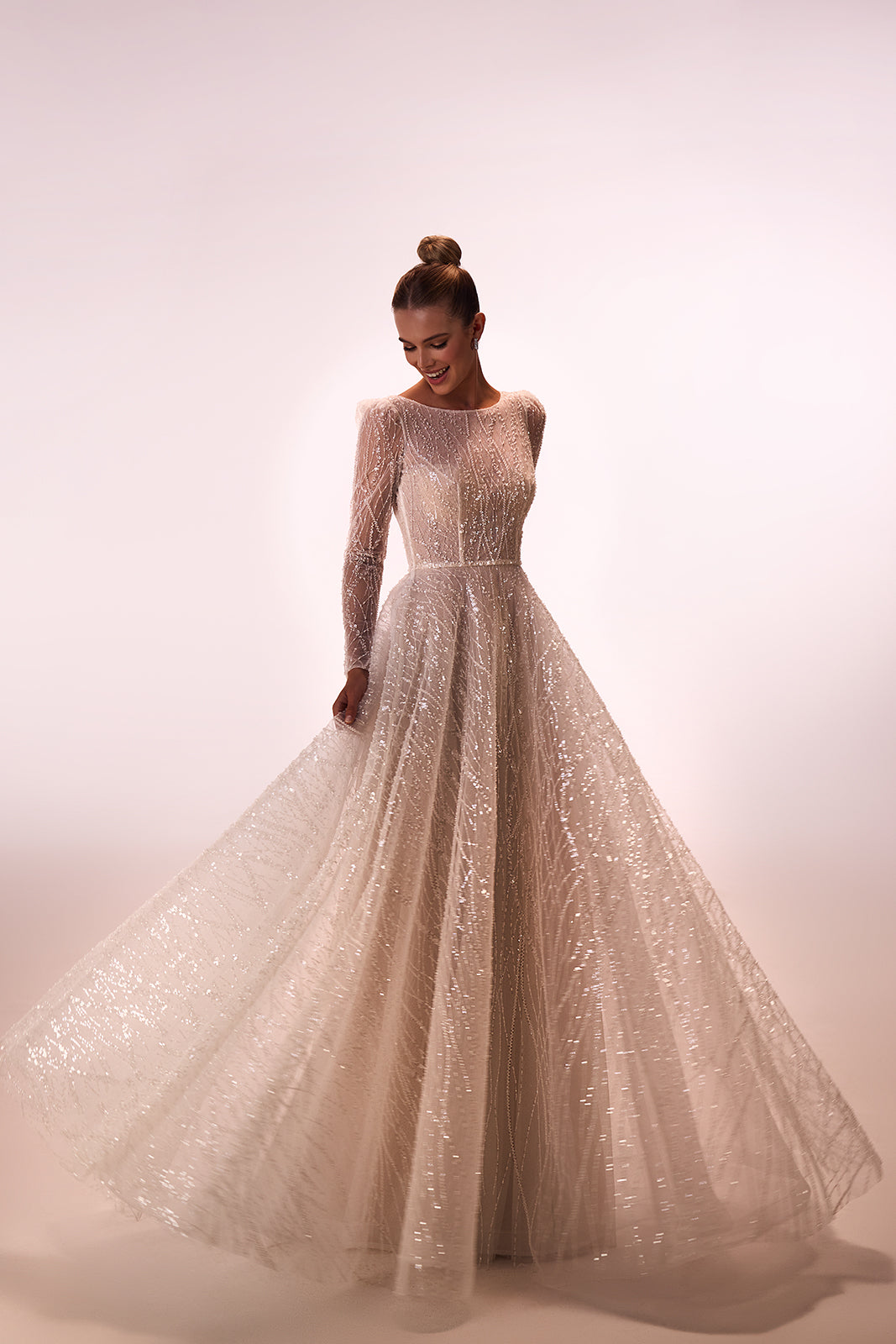 Front studio view of Galia A-line wedding dress, with shimmering bead and sequin embroidery