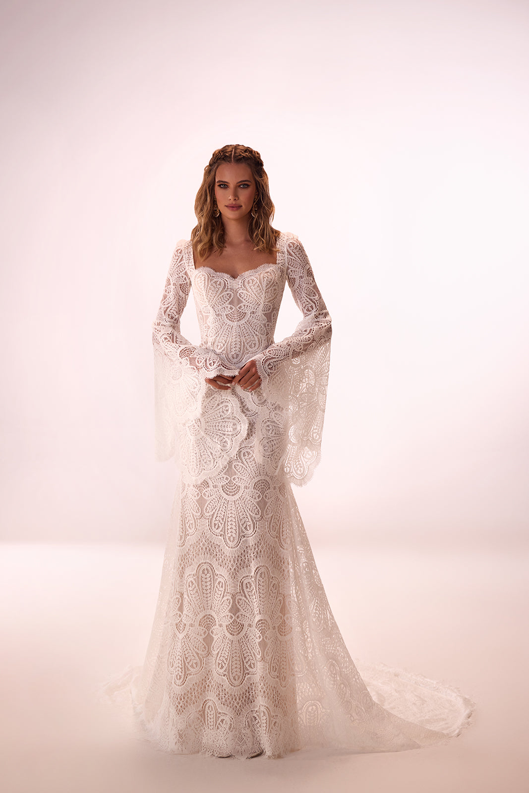 Maya boho lace wedding dress from the front in the studio, with wide flared sleeves