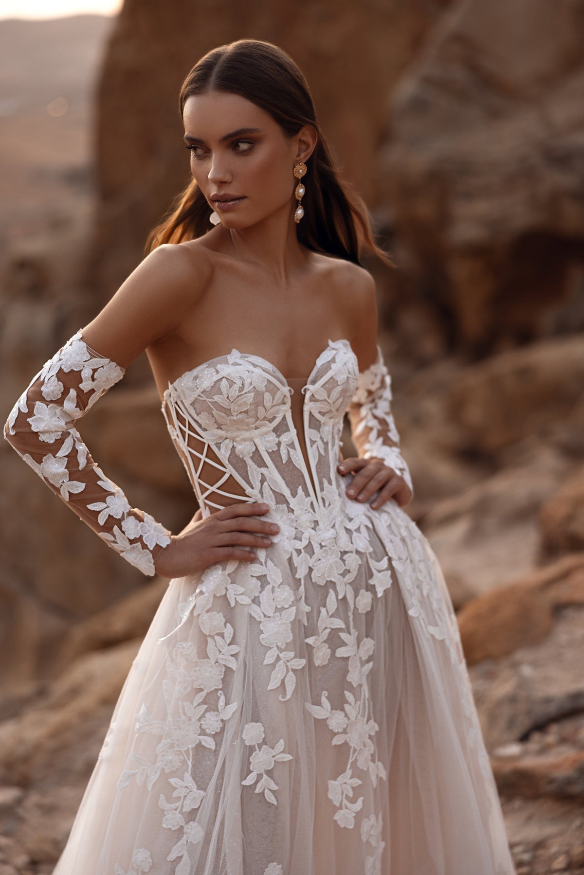 The Nabila wedding dress with a long veil and floral lace details embodies dreamy bridal elegance for a timeless wedding look.