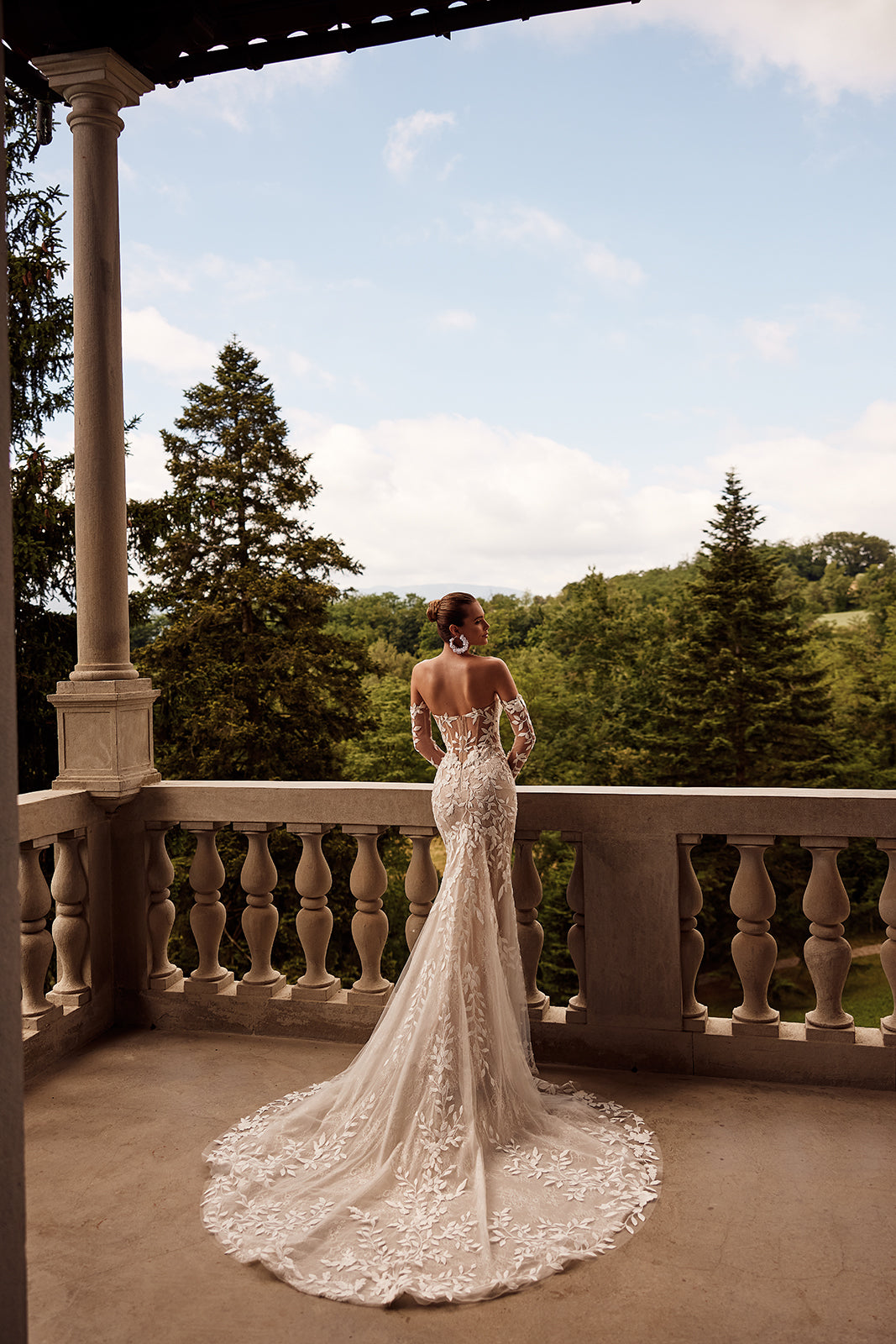Sheer detachable sleeves beside the open back of Procella