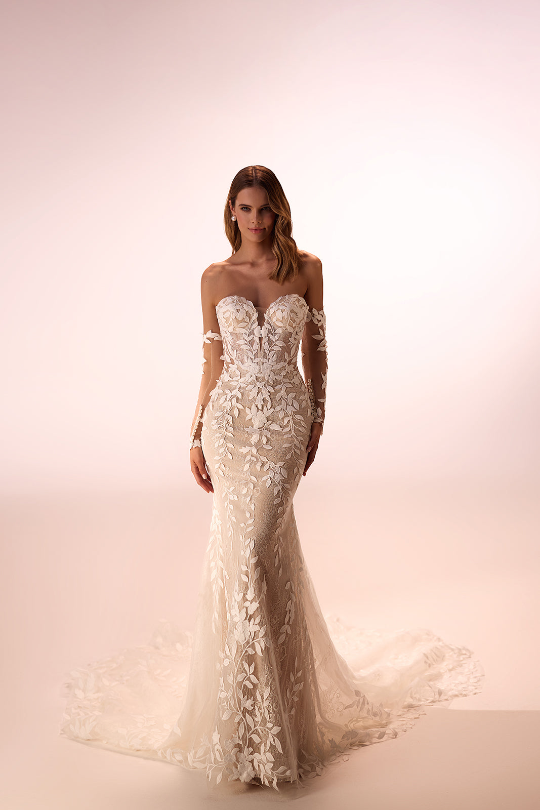 Studio view of Procella with embroidered lace following the fitted silhouette