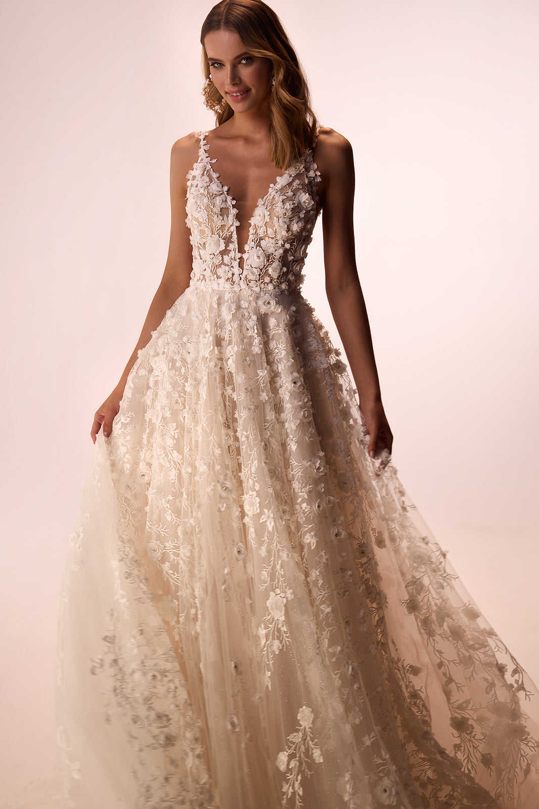 Studio front view of Samsara, with floral lace over beige lining and narrow straps