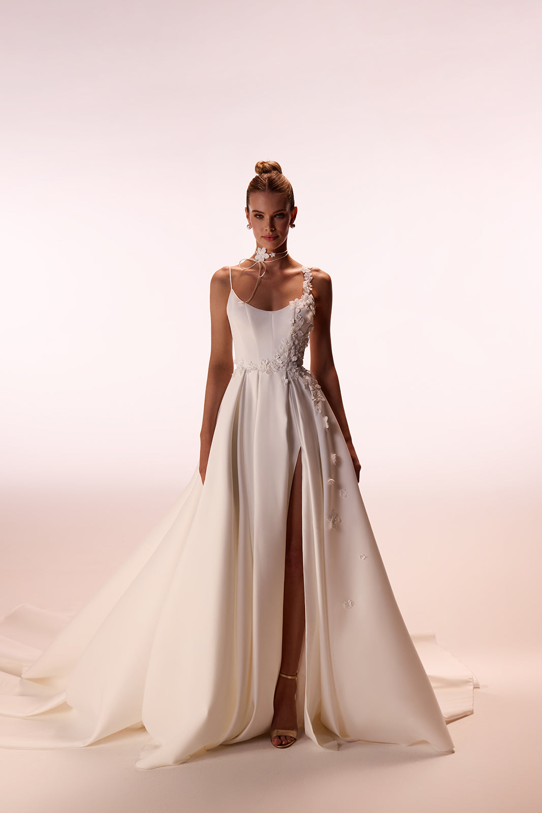 Fitted bodice above the softly falling skirt of Seraphine in the studio
