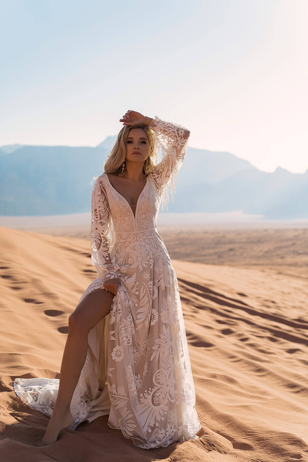 Full silhouette of Onava, combining lace with an A-line tulle skirt