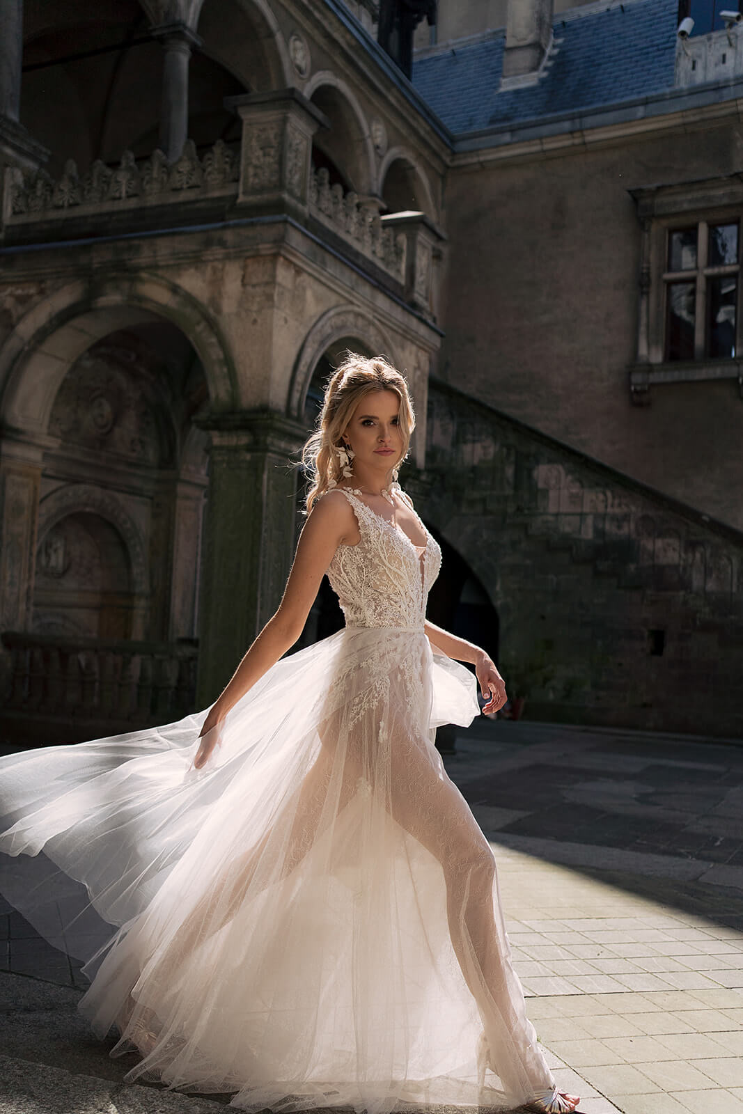 Livia wedding dress in motion, with a wide tulle skirt billowing around the bride