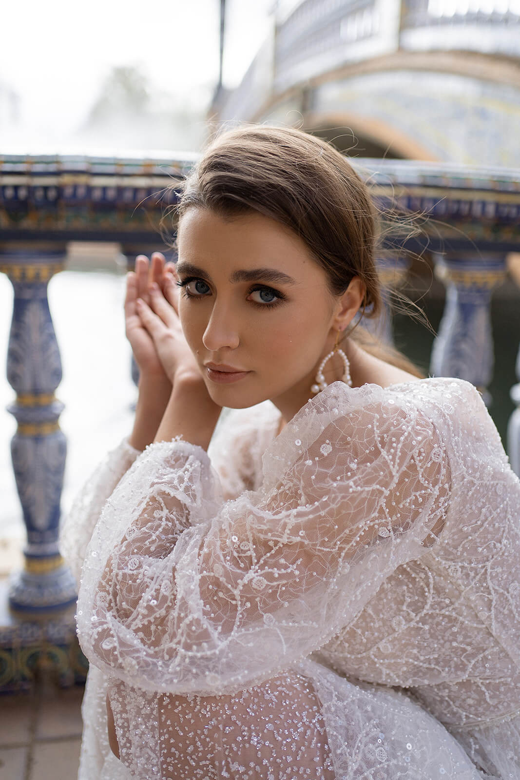 Full-length side view of Suri, with floral lace on the bodice