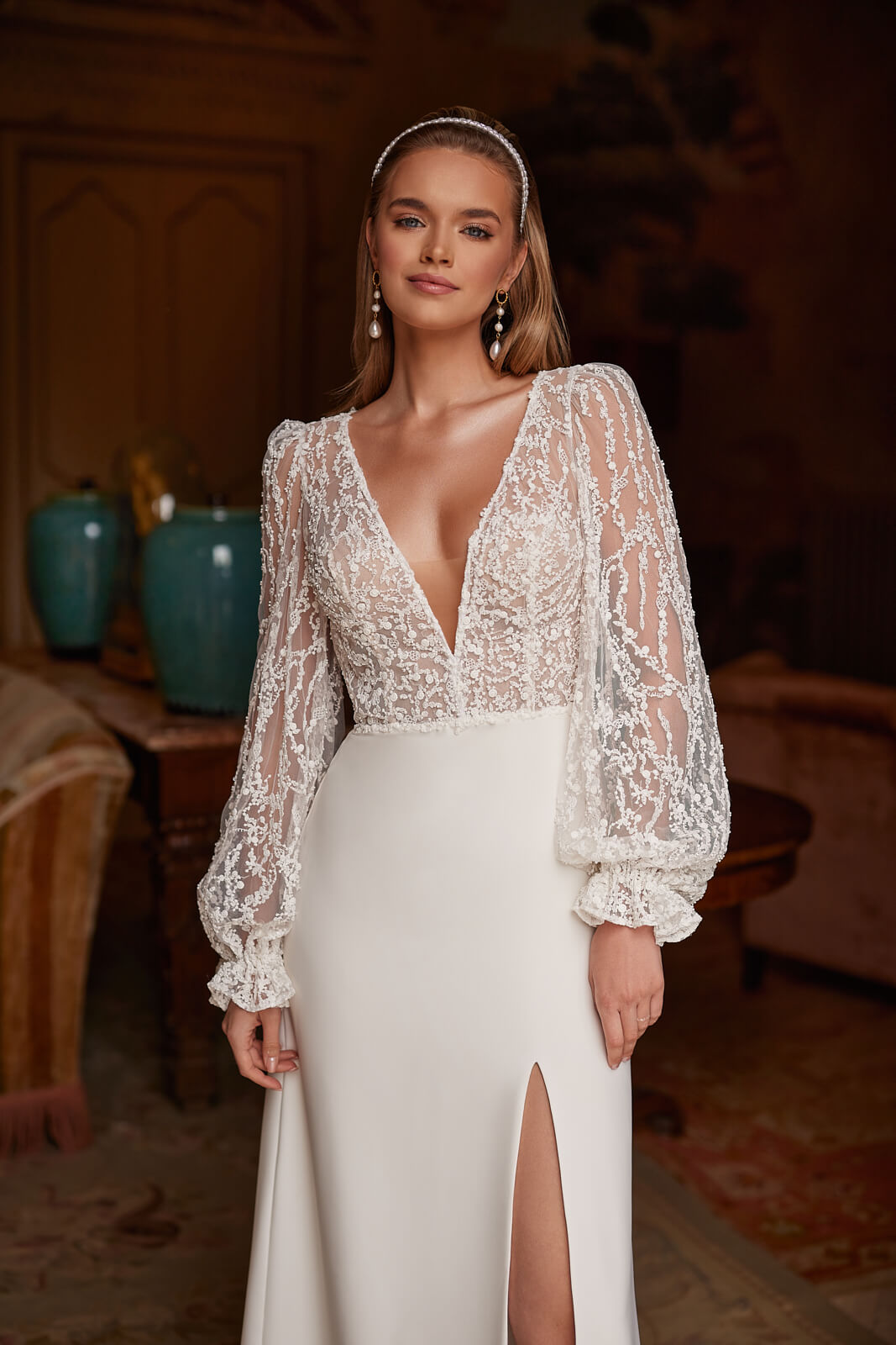 Pearls on the lace bodice of Paula beside full sleeves, shown close up
