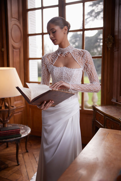 Greta wedding dress – mermaid silhouette with a richly beaded strapless corset and draped satin skirt.
