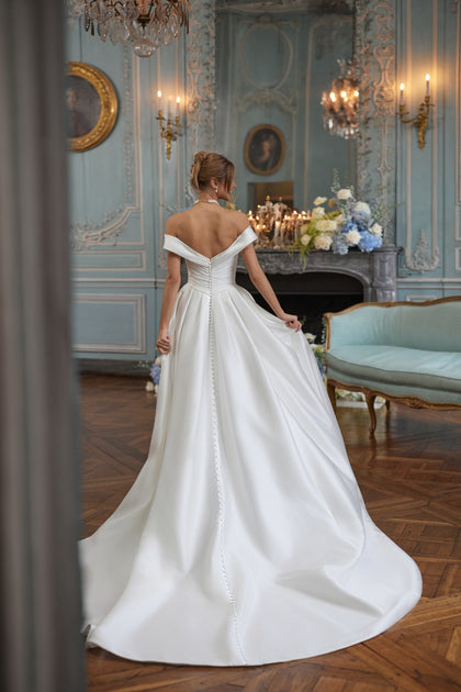 Heloise wedding dress – A-line bridal gown with a softly draped off-the-shoulder neckline in clean satin.