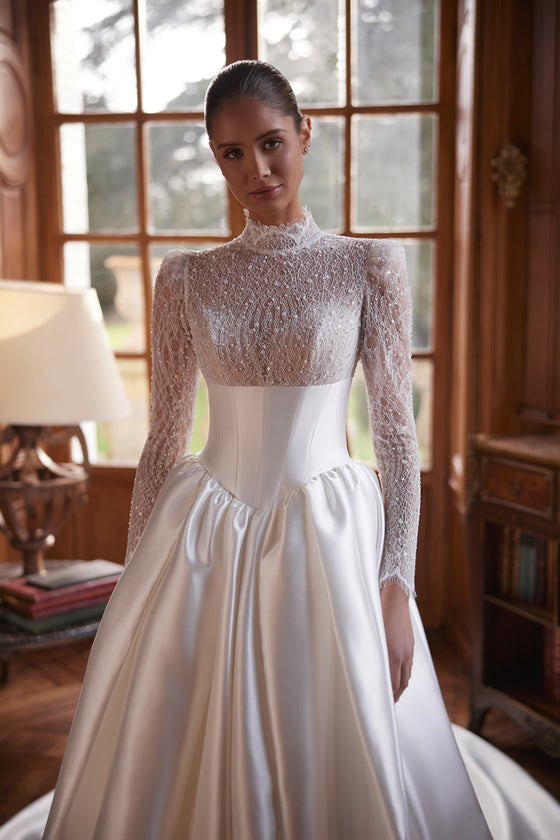 Maristella wedding dress – A-line bridal gown with a high-neck lace bodice with long sleeves and full satin skirt.