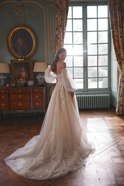 Melusine wedding dress from the Something Blue 2027 collection – a strapless botanical lace bodice and detachable tulle sleeves.