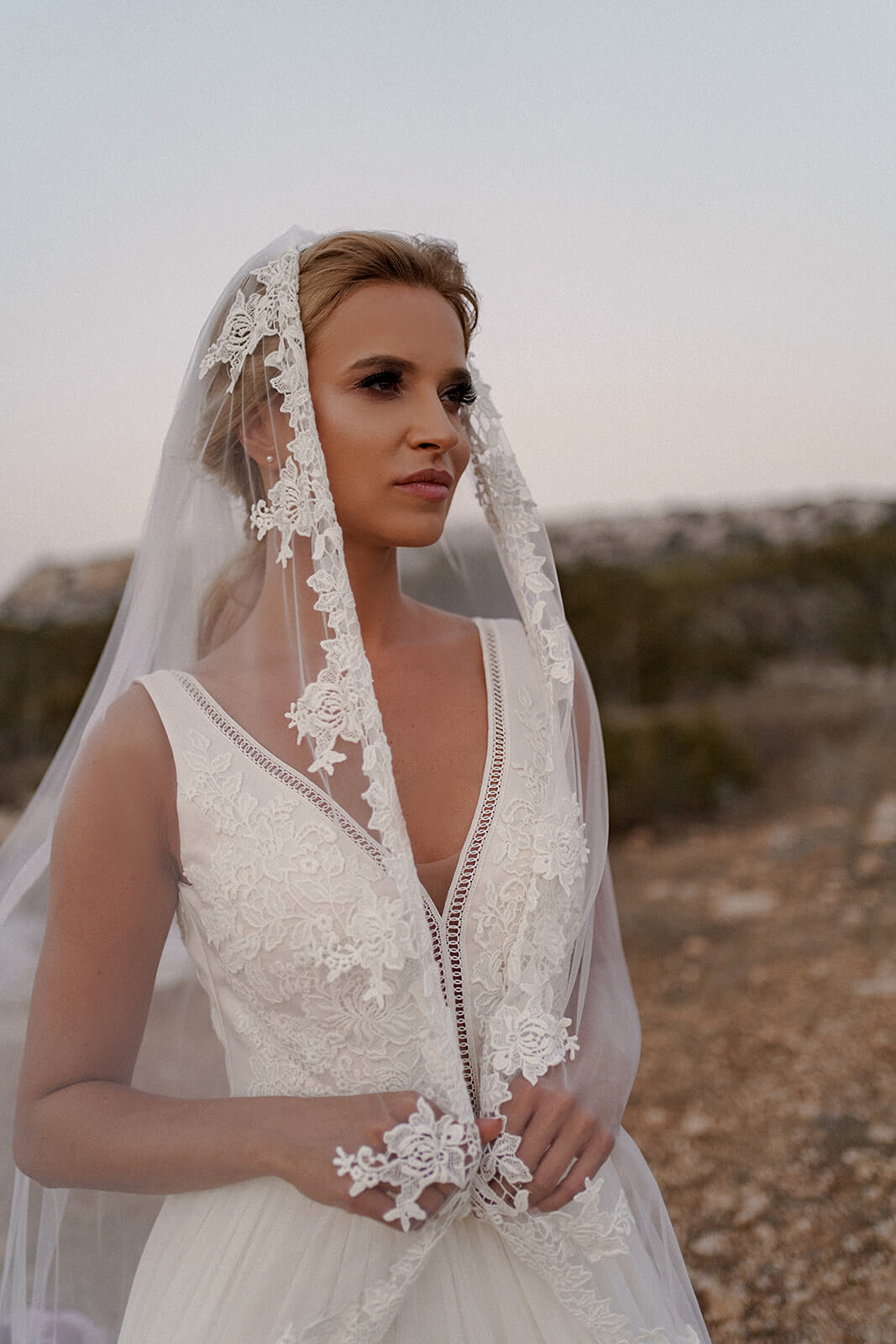 Three-quarter view of Cathedral veil with lace and its patterned border