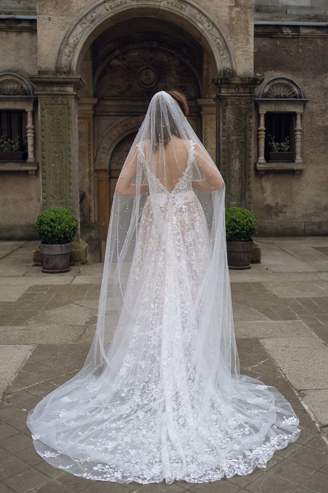 Cathedral pearl veil – DAMA Couture cathedral wedding veil, front view.
