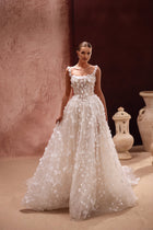 The Cintra bridal gown with intricate floral embroidery and 3D detailing embodies timeless elegance and modern romance.