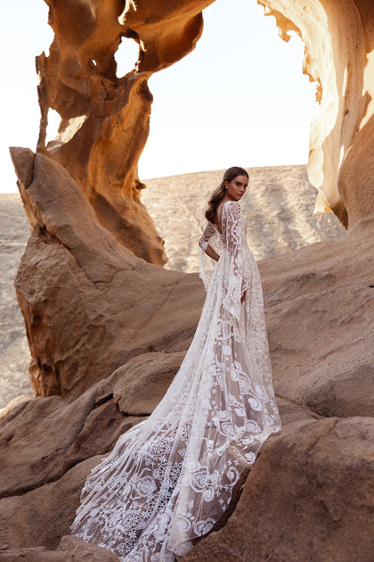 The Dune bridal dress features a beautifully embroidered lace back and a sweeping train full of romantic movement.