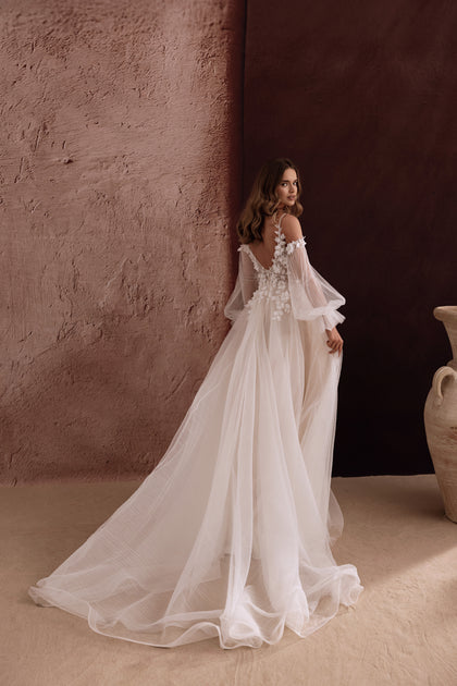 Lilibeth bridal dress with a lace bodice and 3D floral embellishments creates a romantic, whimsical wedding style.