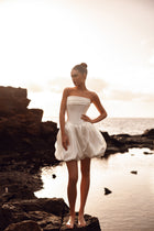 Martini strapless mini bridal dress with structured bodice and bubble hem, ideal for a city wedding or contemporary bride.