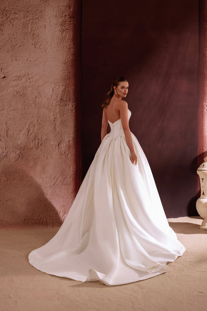 The Noor bridal gown featuring a sweetheart neckline and structured corset radiates romantic sophistication.