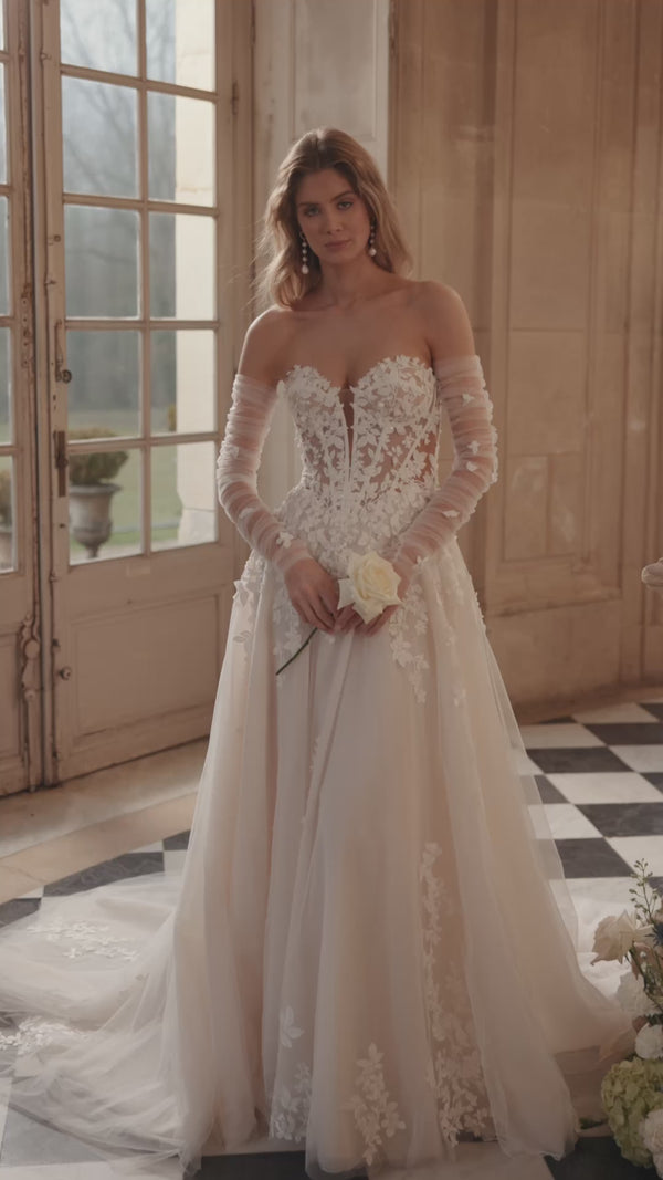 Video of the Ines wedding dress in motion – A-line silhouette with a sculpted strapless bodice and floral lace tulle skirt.