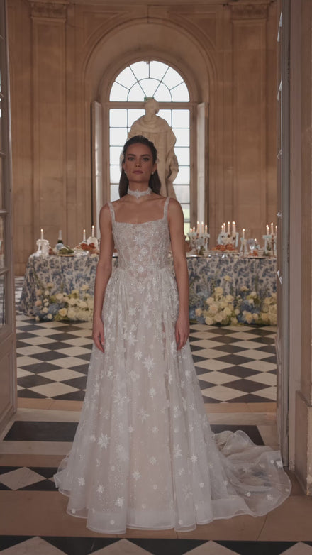 Video of the Milkyway wedding dress in motion – A-line silhouette with a square neckline and star-embroidered tulle skirt.