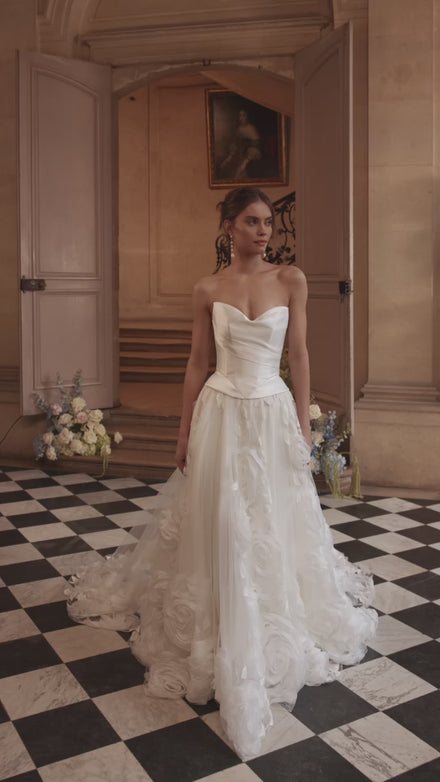 Video of the Cornellia corset + skirt in motion – A-line silhouette with an asymmetrically draped corset and voluminous layered skirt.