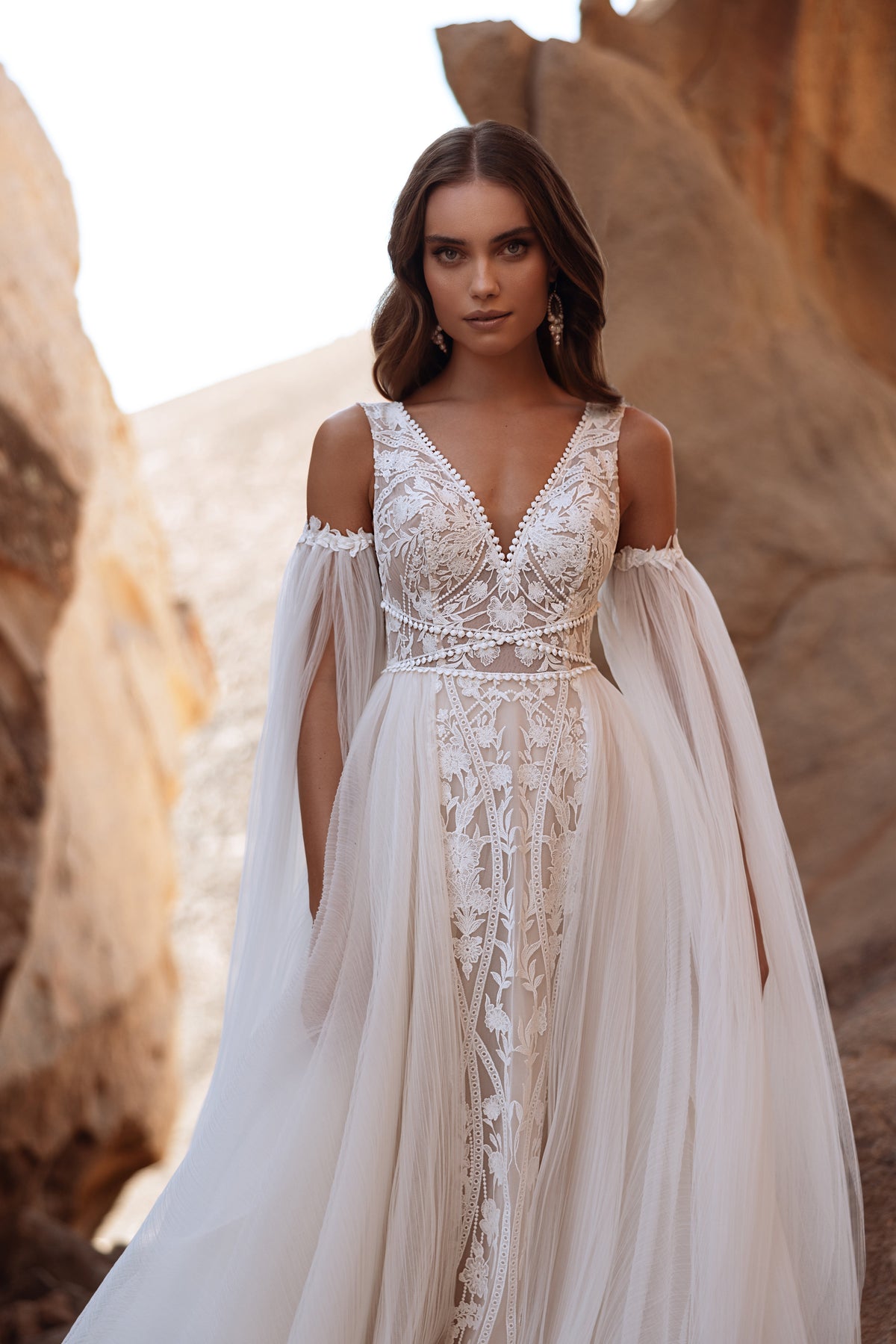 Waist-up Salome boho wedding dress, with a deep V neckline and wide tulle sleeves