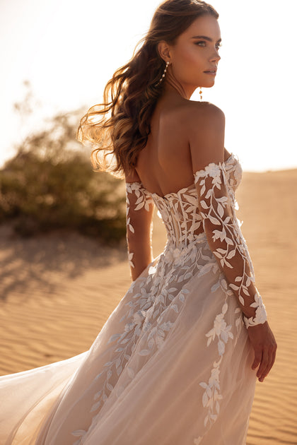 The Tamara bridal dress with floral lace details and off-shoulder design exudes soft romantic charm.